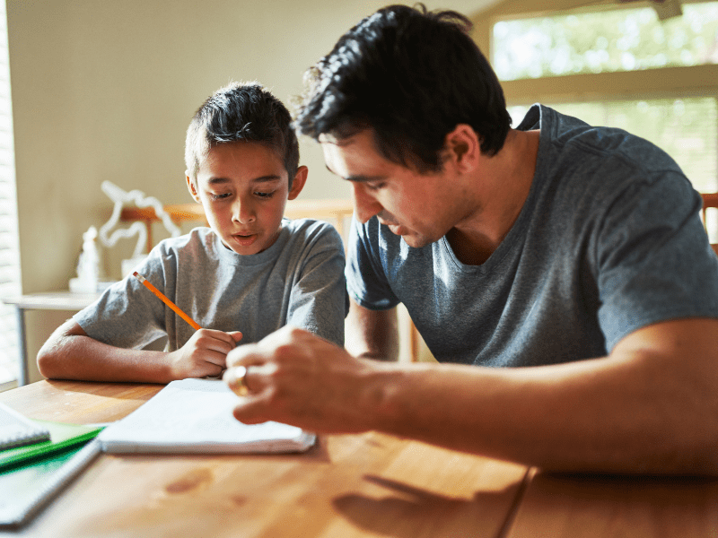 Parent and child reviewing a reading assignment together at home