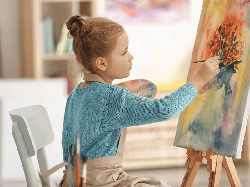 oung learner painting during a kindergarten homeschool arts and crafts activity